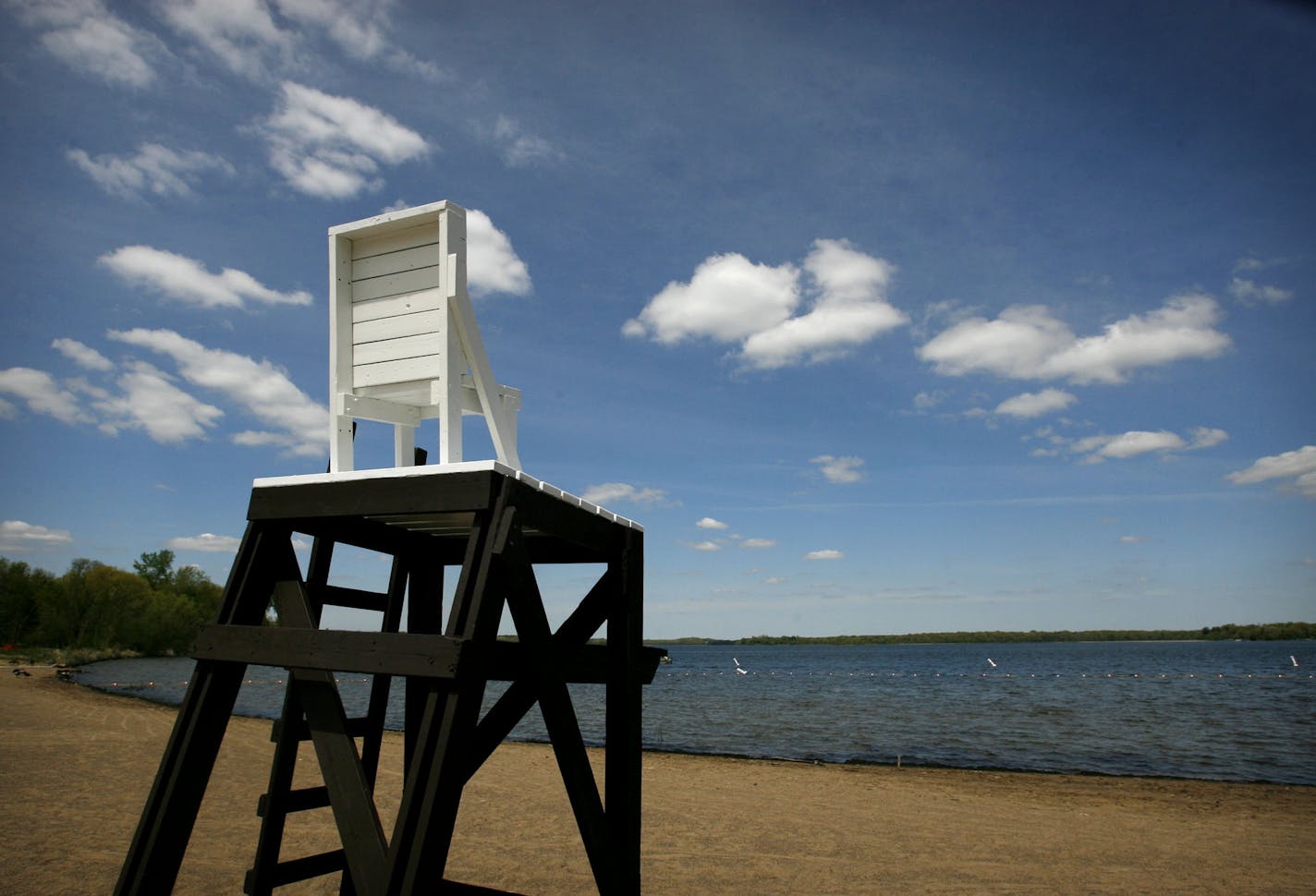 DAVID JOLES &#xef; djoles@startribune.com Washington, County, MN - May 23, 2008 - An empty lifeguard's chair and beach will not remain empty for long at Big Marine Park Reserve. A grand opening ceremony will be held June 7 to herald a 350 foot long swimming beach with a boat launch onto Big Marine Lake -- one of the metro area's bet recreational lakes. ORG XMIT: MIN2013072315544677