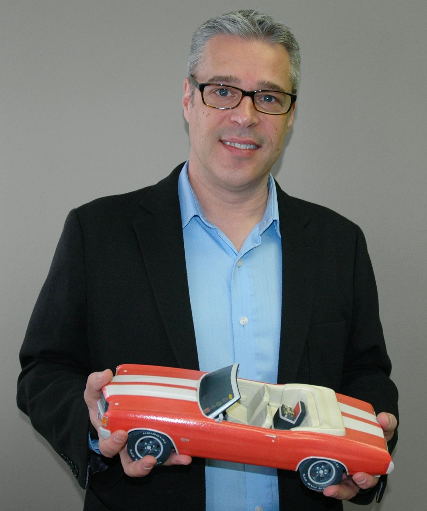 CEO Pete Saari of Foreverence with a 3D Printer-customized urn for a customer who loved his 1971 Chevy Chevelle.