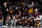 The Gopher bench celebrated a second quarter basket against the Iowa Hawkeyes. "We'll continue to battle," coach Lindsay Whalen said after her team's 