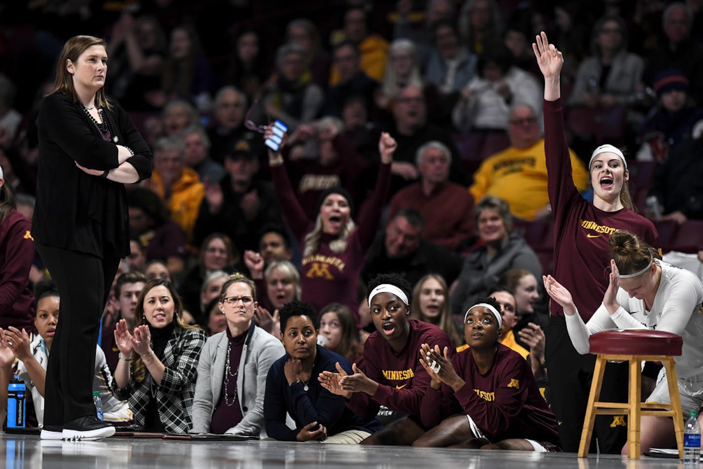 The Gopher bench celebrated a second quarter basket against the Iowa Hawkeyes. "We'll continue to battle," coach Lindsay Whalen said after her team's last-second defeat.