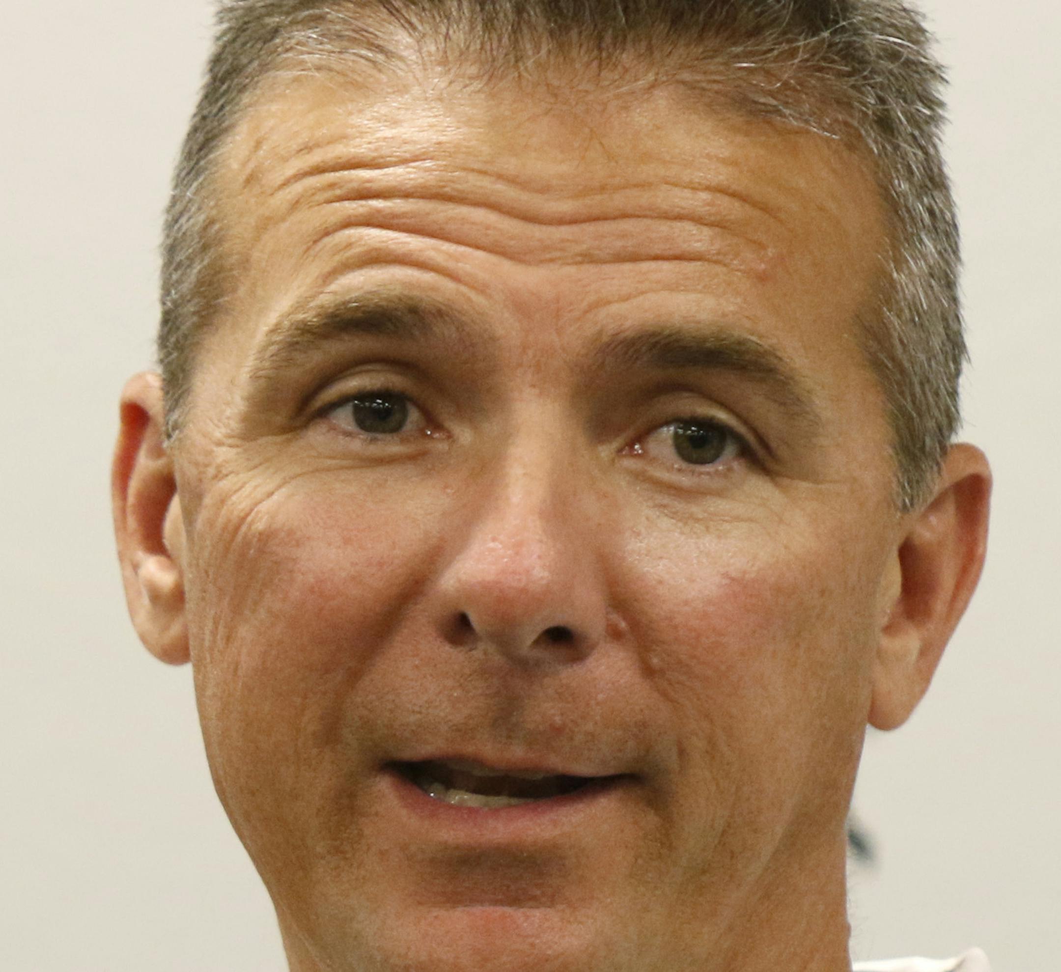 Ohio State coach Urban Meyer speaks to reporters during the university's NCAA college football media day in Columbus, Ohio, Sunday, Aug. 16, 2015. (AP Photo/Paul Vernon) ORG XMIT: otkohpv6