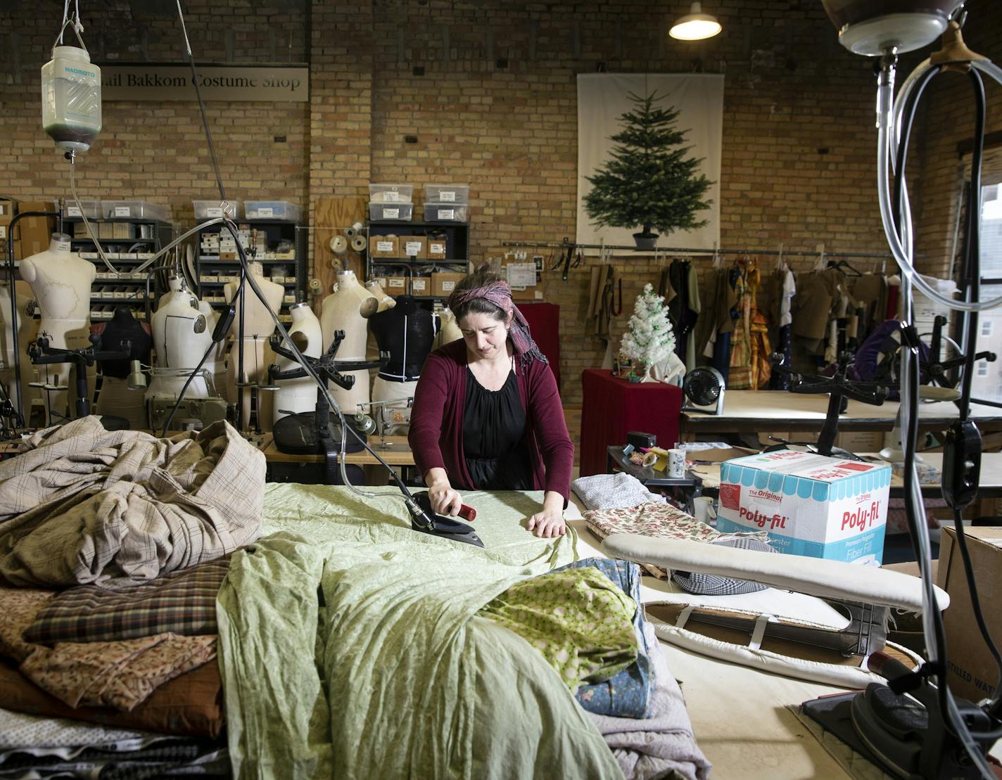 Corrina Bakken, the Minnesota Opera&#x2019;s costume director, irons fabric to sew into masks for hospital workers, in Minneapolis, Minn., March 24, 2020. With overrun hospitals facing an acute shortage of masks, people are pulling out their sewing machines to fill the void. (Tim Gruber/The New York Times) ORG XMIT: XNYT93