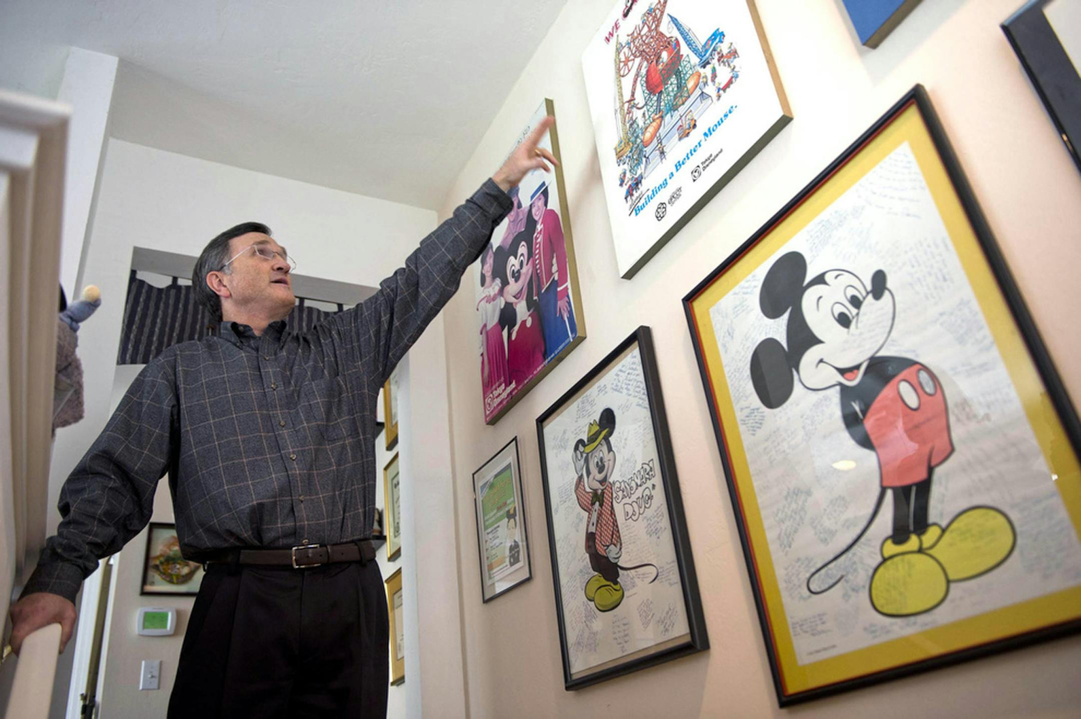 Doug Lipp is a former Disney employee who now runs a consulting business and is the author of "Disney U." He shows some of the Disney memorabilia at his home in Fair Oaks, Calif.