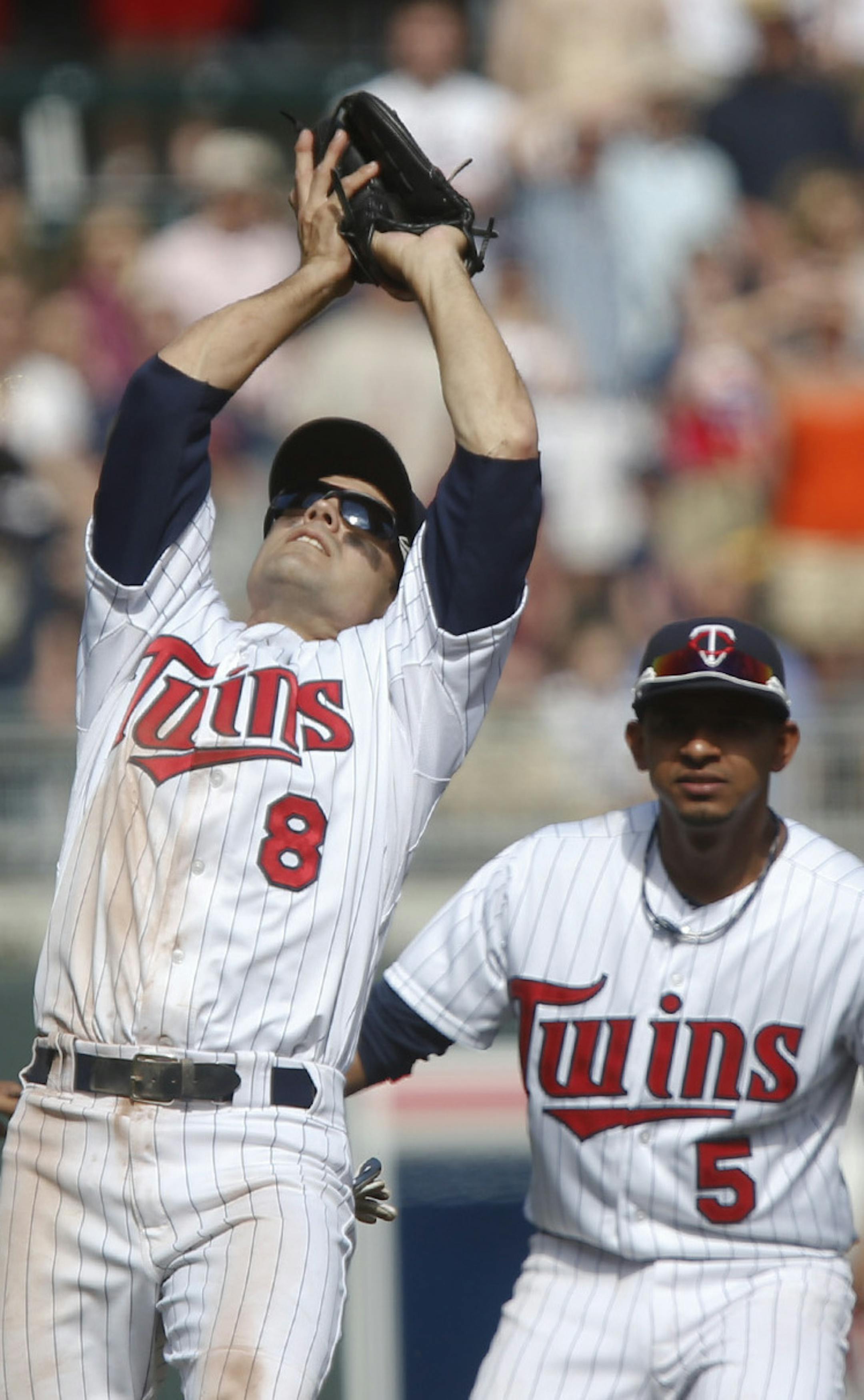 With Eduardo Escobar watching, third baseman Jamey Carroll pulled in the final out of the game. Carroll also went 2-for-3.