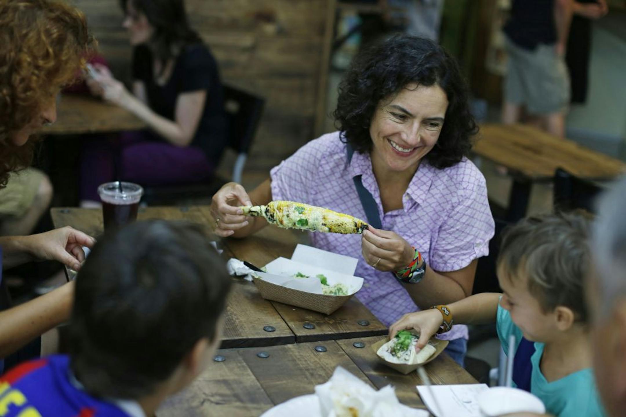 A diner feasted on roasted corn and other specialties at Sonora Grill at the Midtown Global Market.