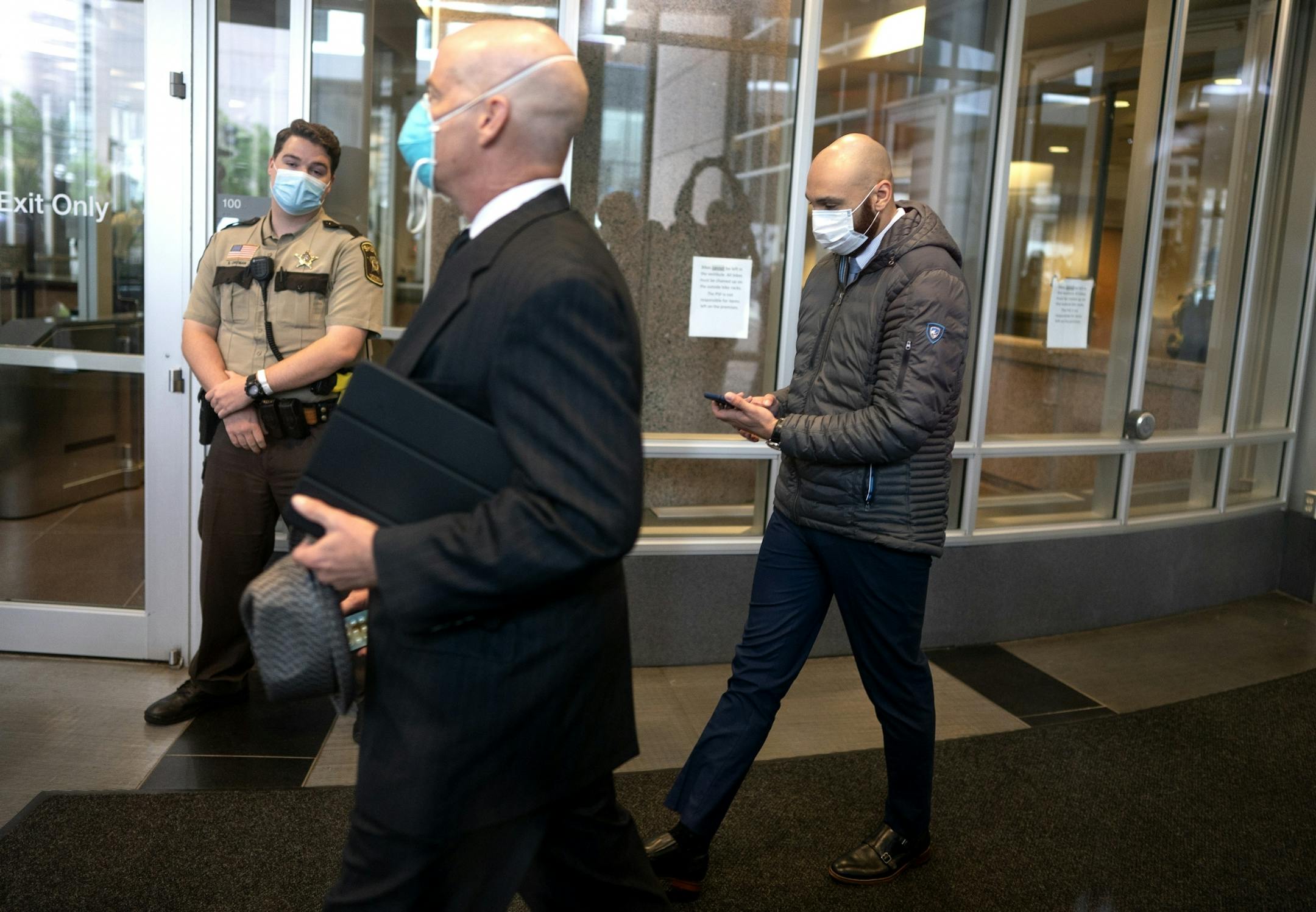 Former Minneapolis police officer J. Alexander Kueng right , entered the Hennepin County Public Safety Facility this morning with his attorney Thomas Plunkett..
