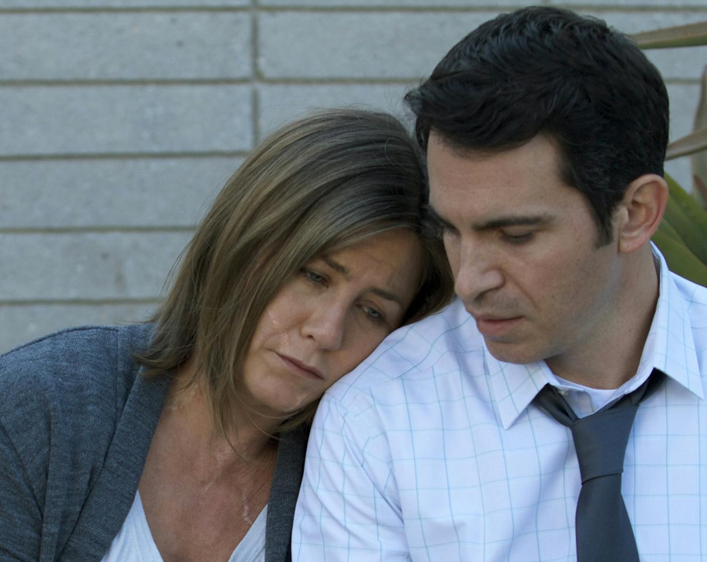 This image released by Cinelou Films shows Jennifer Aniston, left, and Chris Messina in a scene from "Cake." (AP Photo/Cinelou Films)