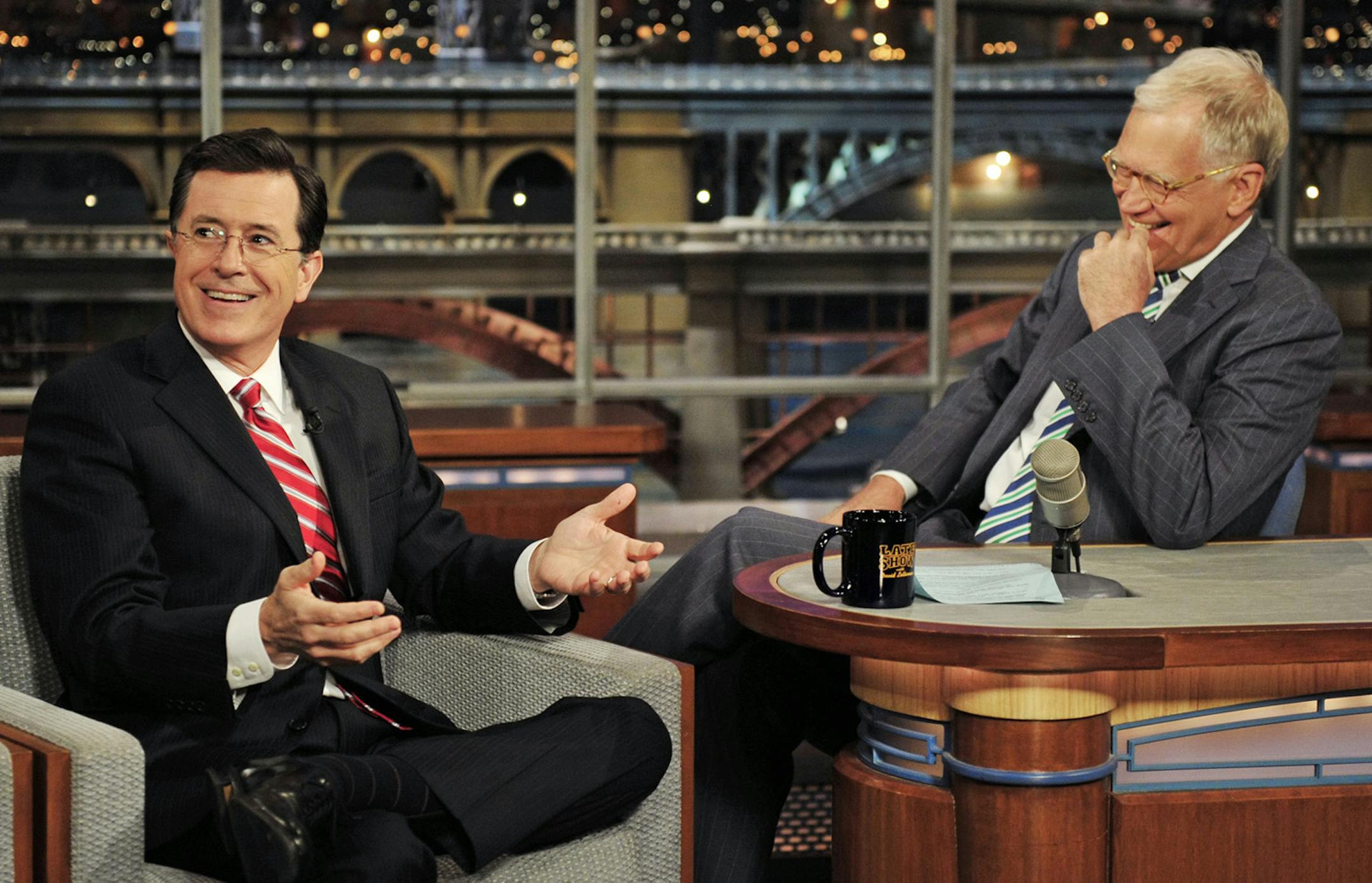 In this May 3, 2012 photo provided by CBS, Stephen Colbert, left, host of the ìColbert Reportî on the Comedy Central Network, has a laugh on stage with host David Letterman on the set of the ìLate Show with David Letterman,î in New York. CBS announced on Thursday, April 10, 2014 that Colbert will replace Letterman as ìLate Showî host after Letterman retires in 2015. (AP Photo/CBS, John Paul Filo) MANDATORY CREDIT, NO SALES, NO ARCHIVE, FOR NORTH AMERICAN USE ONLY
