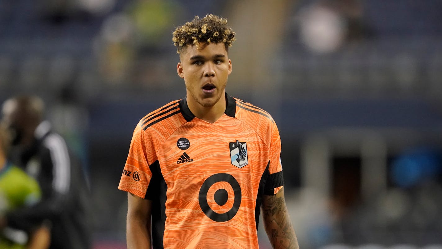 Minnesota United goalkeeper Dayne St. Clair walks off the pitch after an MLS soccer match against the Seattle Sounders, Friday, April 16, 2021, in Seattle. The Sounders won 4-0. (AP Photo/Ted S. Warren)