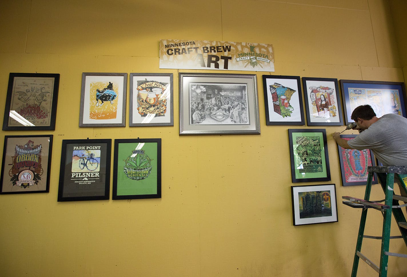 Artworks hangs at the Craft Brewers Guild Land of 10,000 Brews display at the Minnesota State Fair.