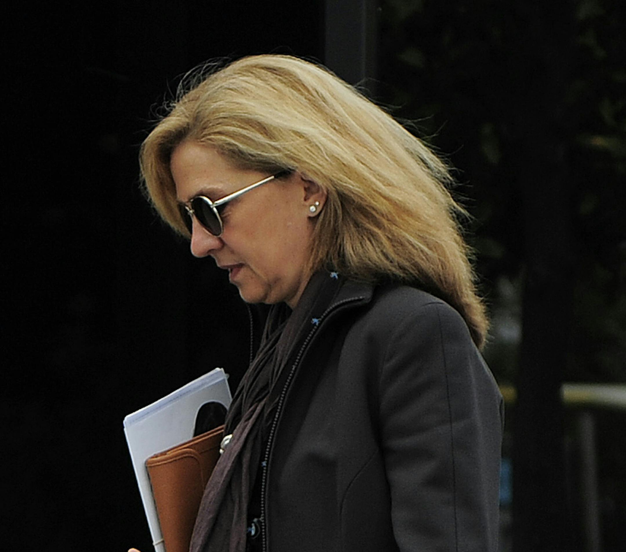 FILE - In this April 5, 2013 file photo, Spain's Princess Cristina walks toward her office in Barcelona, Spain. A Spanish judge on Monday Dec. 22, 2014 has ordered Princess Cristina to be tried along with her husband on charges of tax fraud, marking the first time that a member of the country’s royal family heads to court since the royalty was restored in 1975. The legal troubles of King Felipe VI’s sister during a four-year probe have damaged the Spanish monarchy's image. (AP Phot