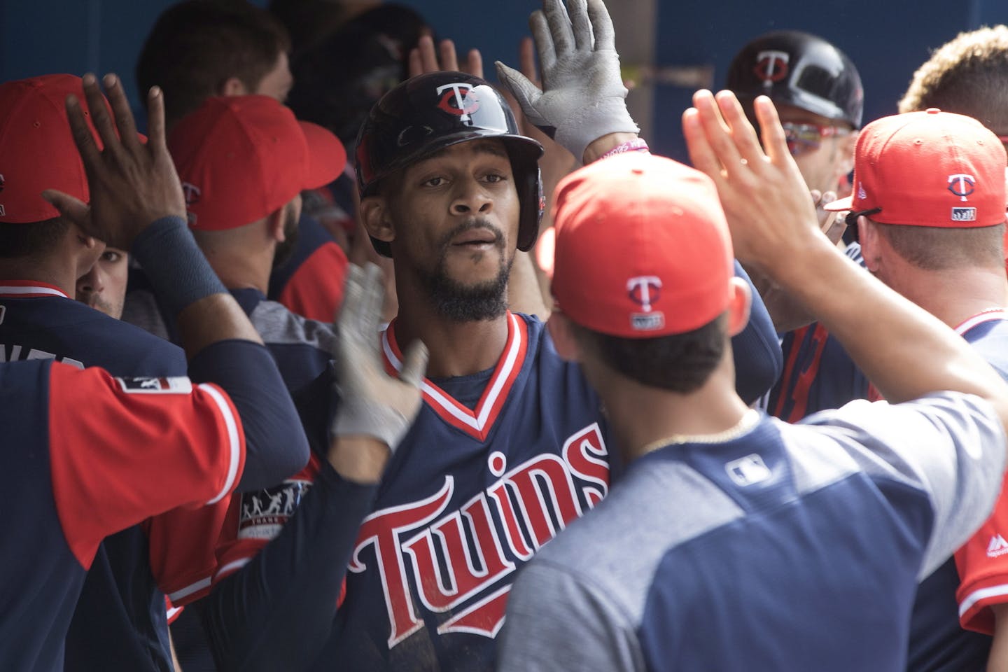 Minnesota Twins Byron Buxton celebrates in the dugout after hitting a a two-run home run off Toronto Blue Jays starting pitcher Joe Biagini during fourth-inning baseball game action in Toronto, Sunday, Aug. 27, 2017. (Chris Young/The Canadian Press via AP)