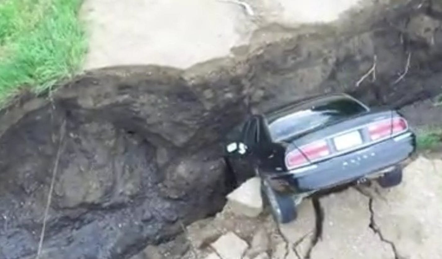 A 16-year-old driver escaped without any injuries after driving into a split up township road in Renville County on July 3, 2018 after rainfall washed out the culvert below the road.