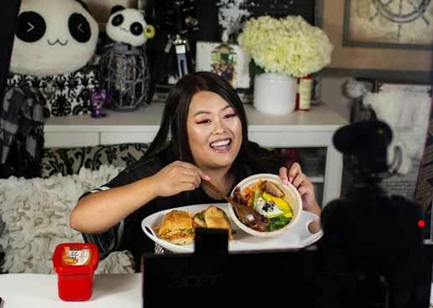 Tassie Yang, who started watching mukbang videos after her personal trainer suggested she try a no-carbohydrate diet, filmed a video with food from Sweet Chow in Minneapolis.