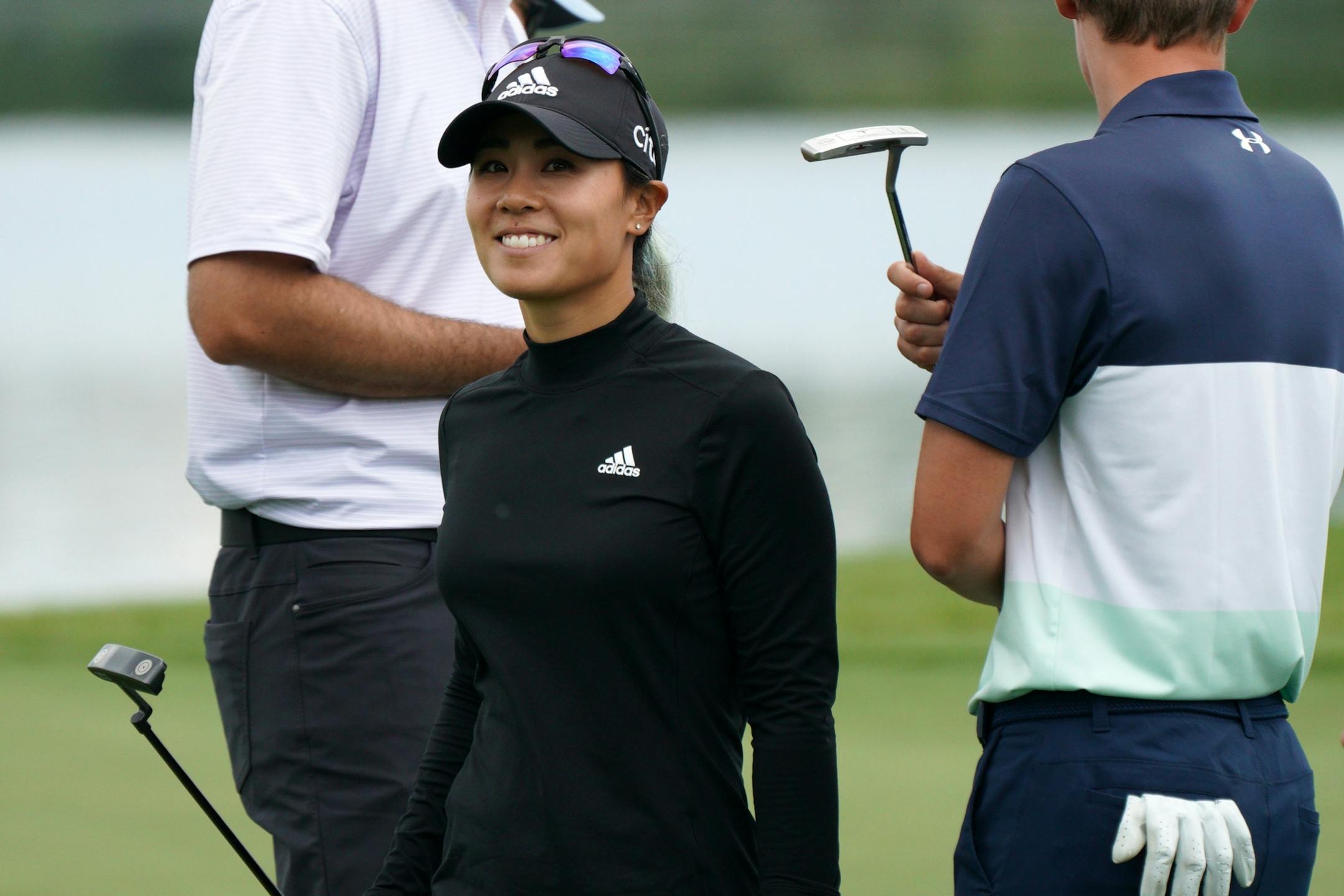 Danielle Kang smiled after sinking a putt on the 16th green Tuesday afternoon.