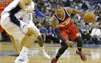 Washington Wizards guard Bradley Beal, right, looks to get around Orlando Magic center Nikola Vucevic, left, during the first half of an NBA basketbal