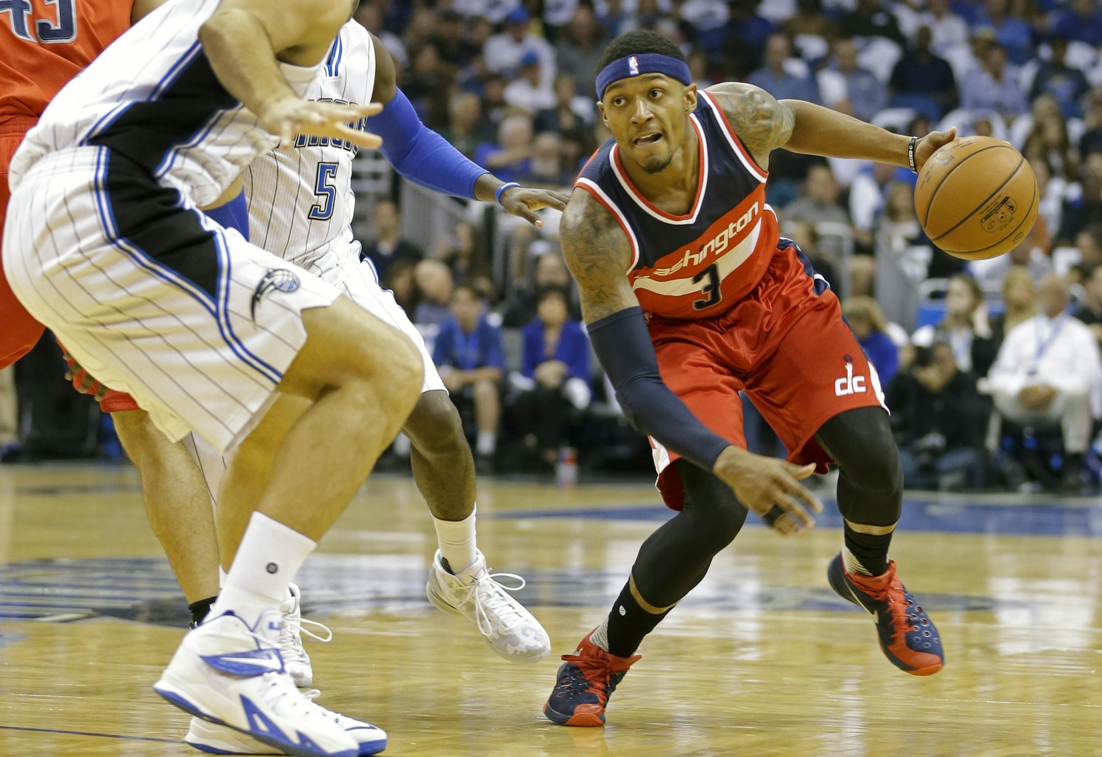 Washington Wizards guard Bradley Beal, right, looks to get around Orlando Magic center Nikola Vucevic, left, during the first half of an NBA basketball game, Wednesday, Oct. 28, 2015, in Orlando, Fla. (AP Photo/John Raoux)