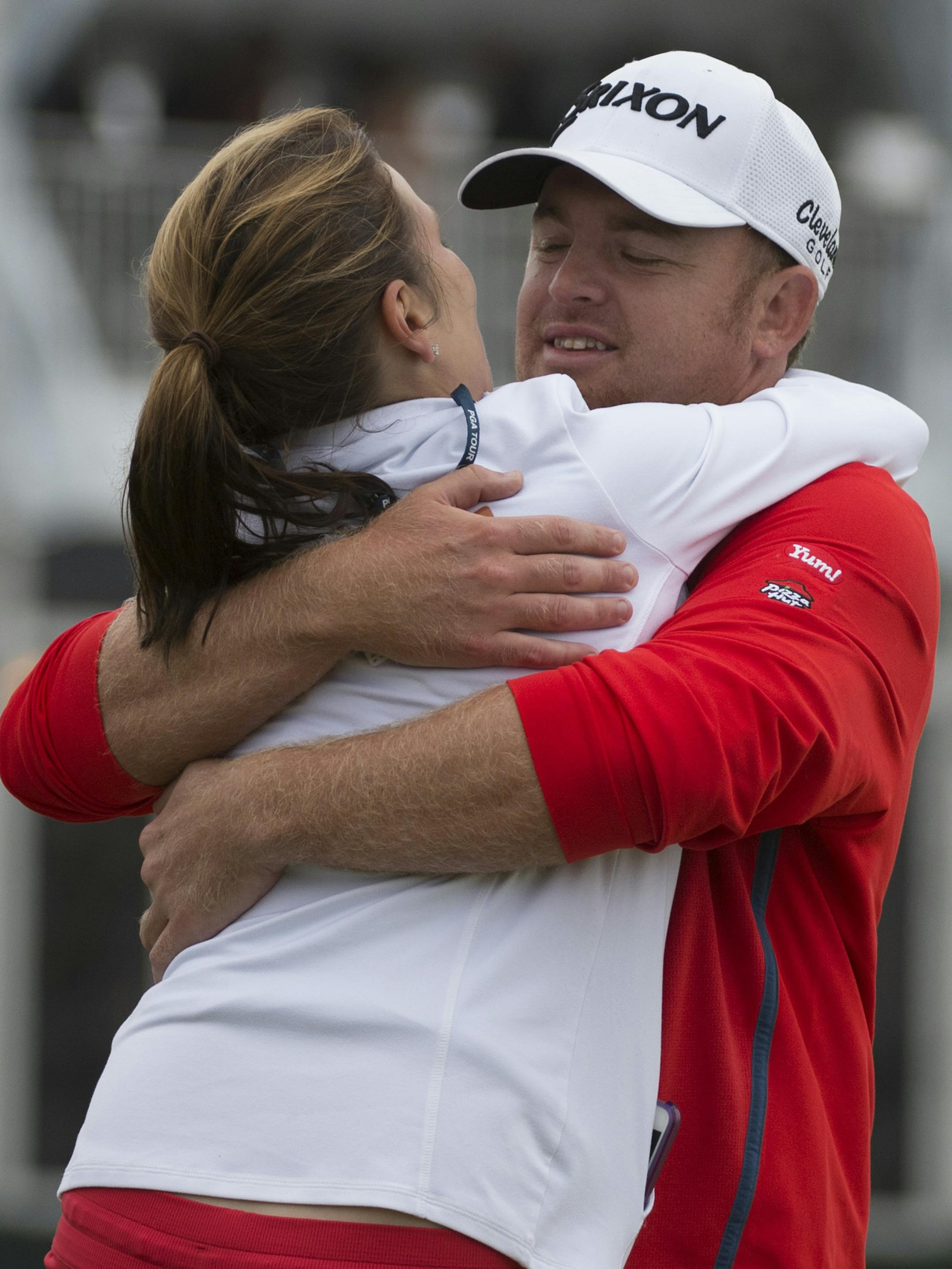J.B. Holmes celebrates with his wife, Erica, after winning the Houston Open golf tournament in a playoff Sunday, April 5, 2015, in Humble, Texas. (AP Photo/George Bridges)