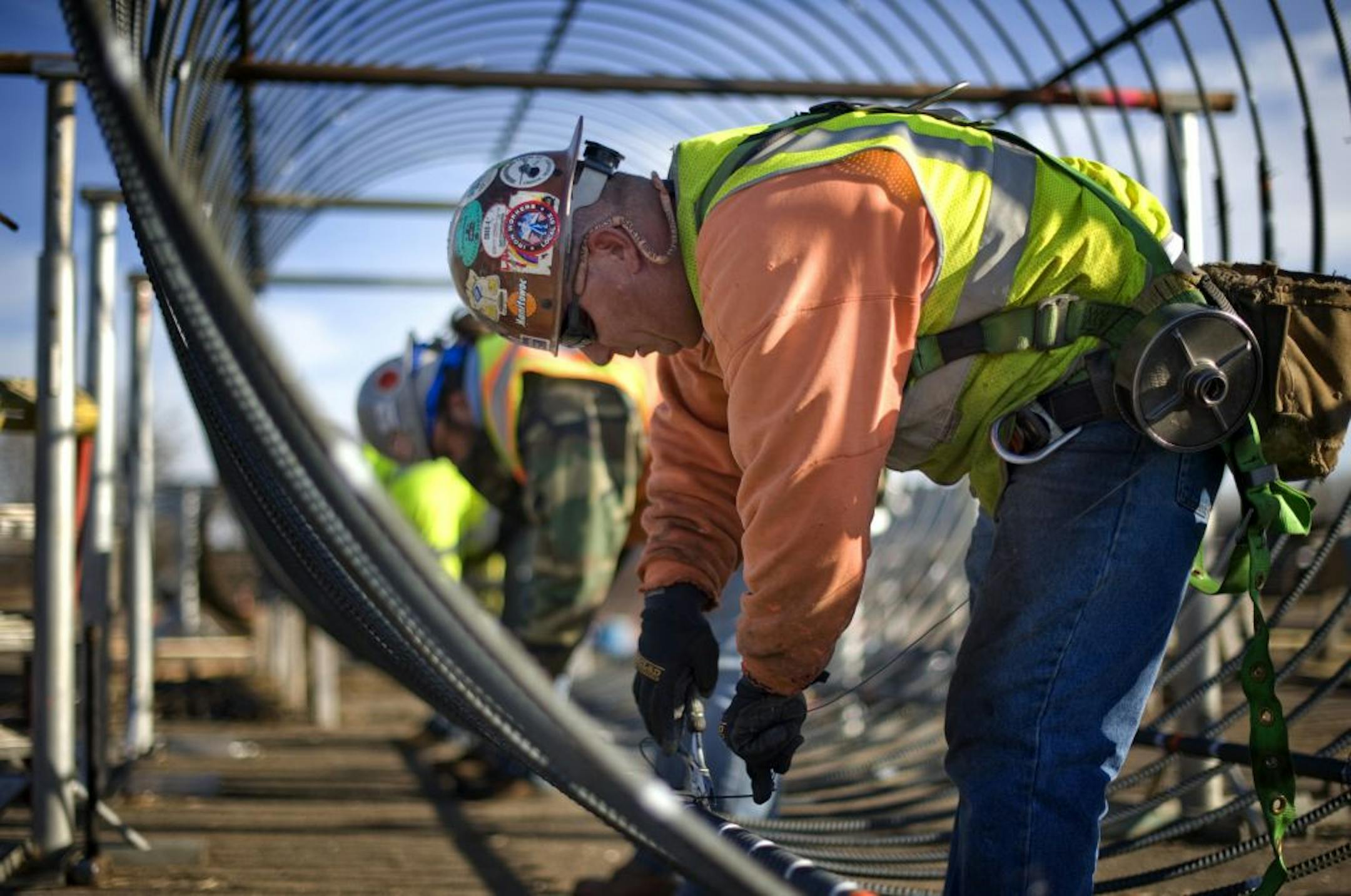 Tim Boyd wired together rebar to form a frame that will become a foundation for one of the transmission line towers being built by CapX2020 during work done last November.