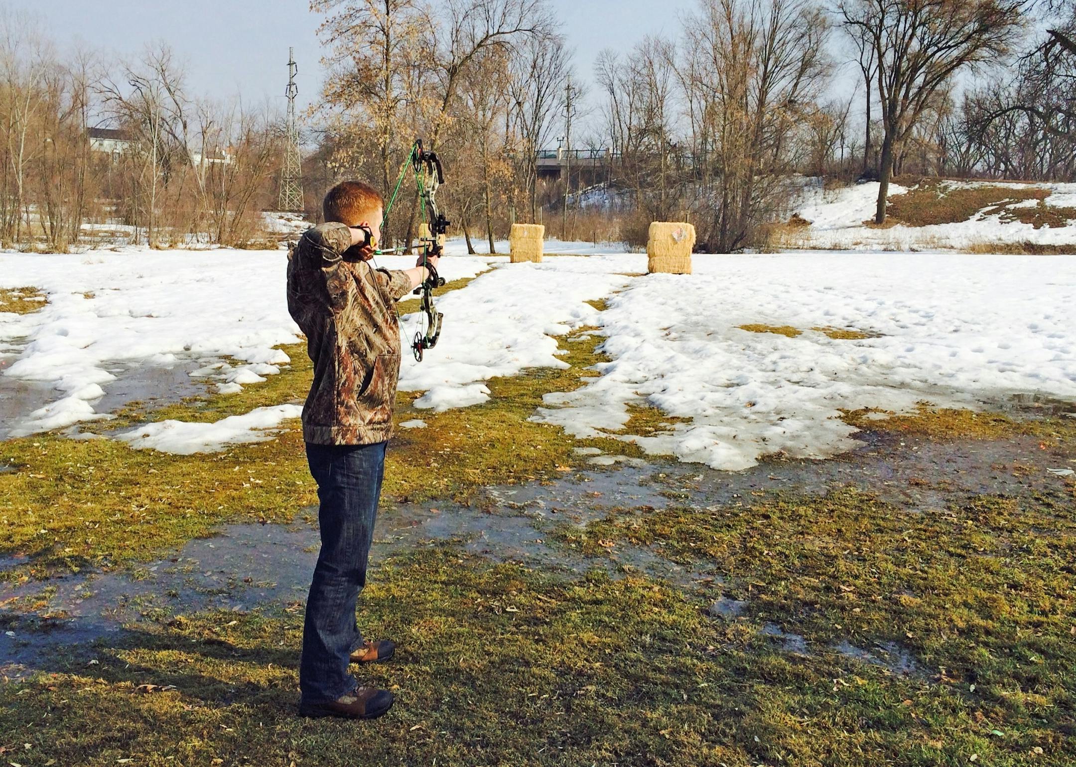 The balmy Sunday drew Zach Burton, 23 of Minneapolis, and a friend to Theodore Wirth Park's archery range to target shoot. Photo: Jim Adams/Star Tribune