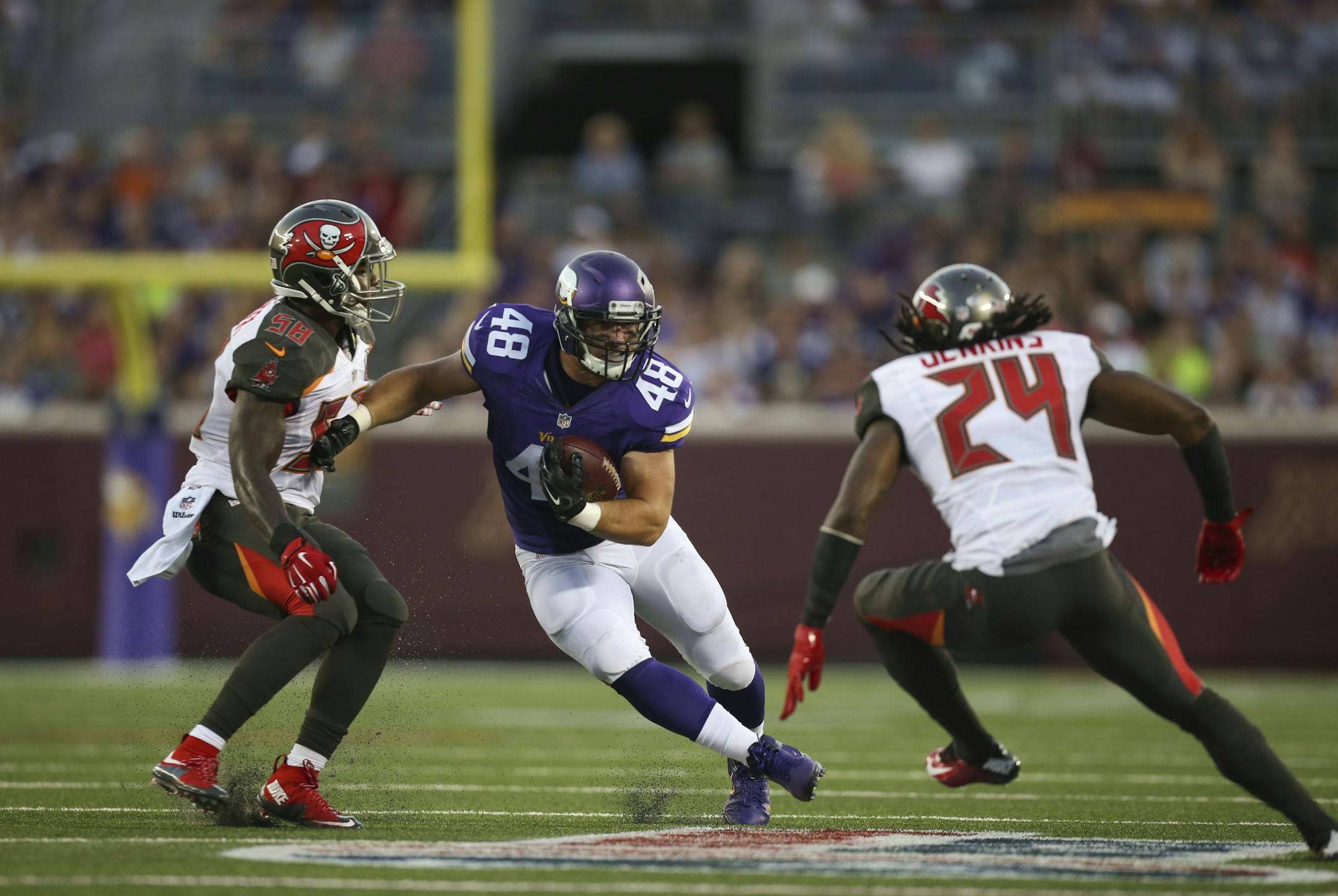 Vikings fullback Zach Line (48) made a move on Buccaneers cornerback Mike Jenkins (24) and Buccaneers outside linebacker Kwon Alexander (58) after catching a second quarter pass for a nine yard gain at TCF Bank Stadium Saturday night.