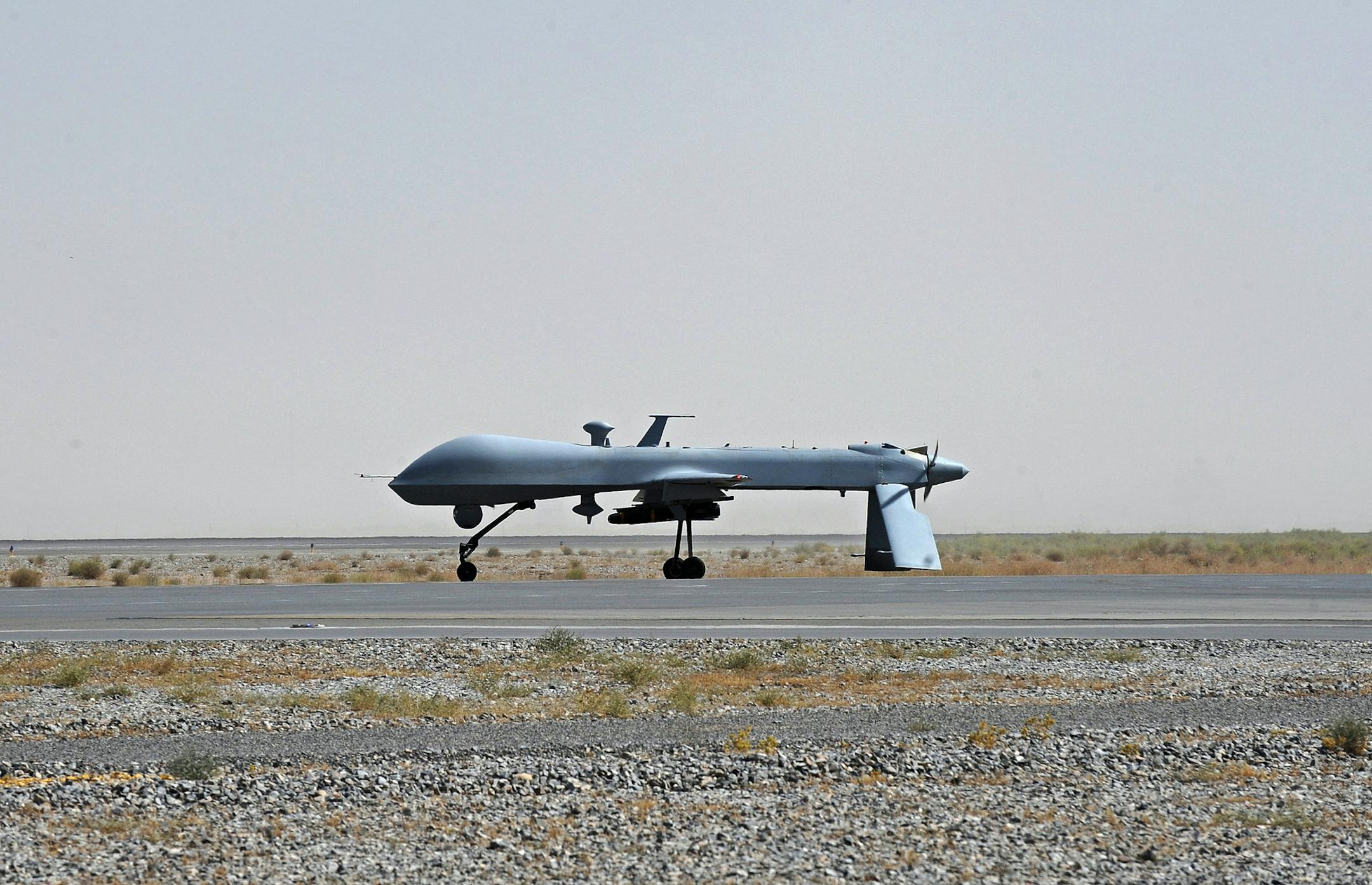 FILE - In this June 13, 2010, file photo a U.S. Predator unmanned drone armed with a missile stands on the tarmac of Kandahar military airport in Afghanistan. Hunting al-Qaida targets from Pakistan to Afghanistan, Yemen to Somalia, the fleet of U.S. armed Predator and Reaper drones that killed two American members of al-Qaida in Yemen Friday, Sept. 30, 2011, are the night stalkers of the expanded U.S. war on terrorists.