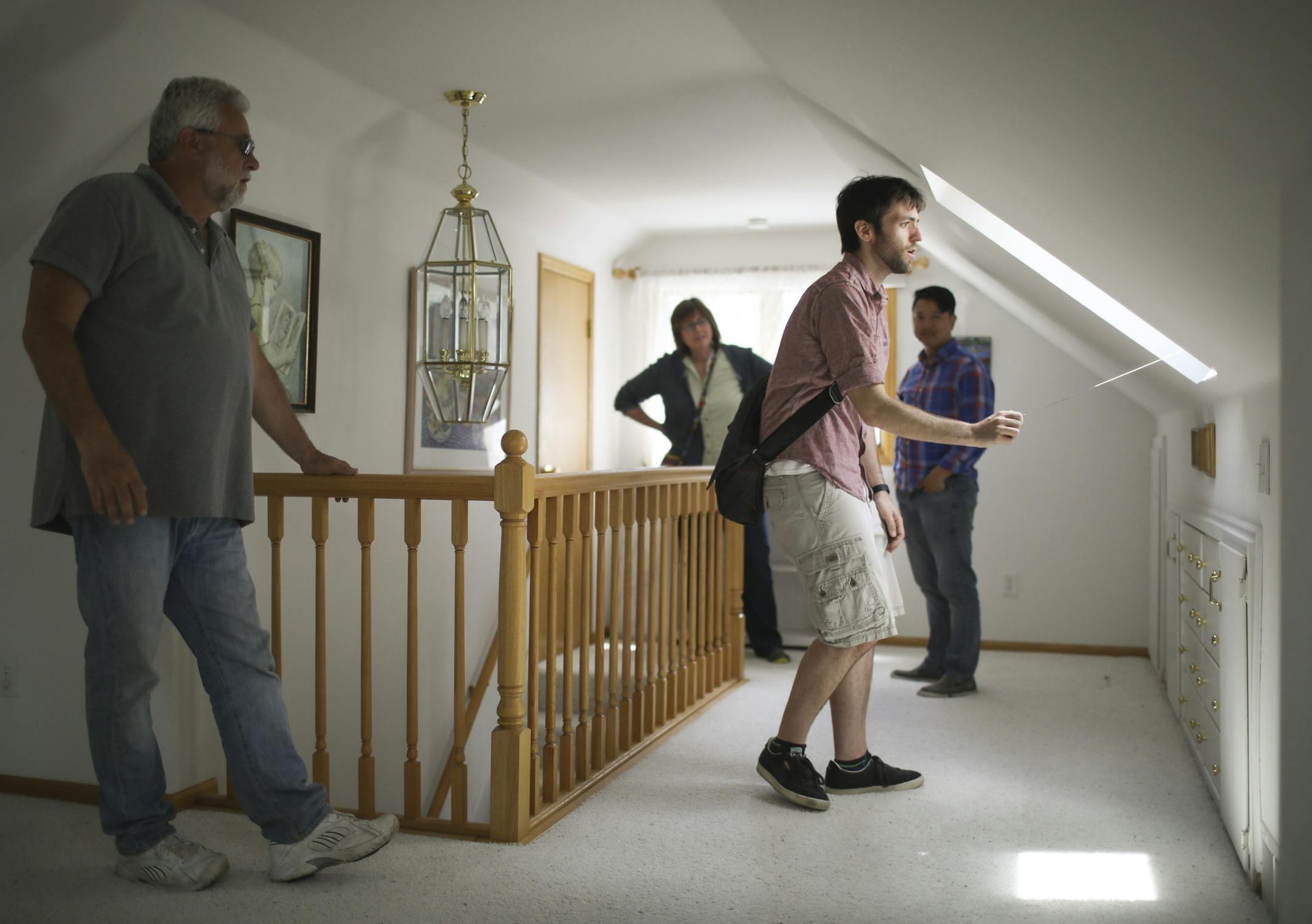 Sam Koehn worked the blinds in the skylights for the first time in the upstairs bedroom of the home he and his wife are buying in Richfield. With him on a tour were his parents, Mike and Franci Koehn and his realtor, Man Huynh. ] JEFF WHEELER ï jeff.wheeler@startribune.com House listings declined dramatically during June, according to a monthly sales report from the Minneapolis Area Association of Realtors. Realtor Man Huynh at a showing of a Richfield house his client, Sam Koehn has a purc