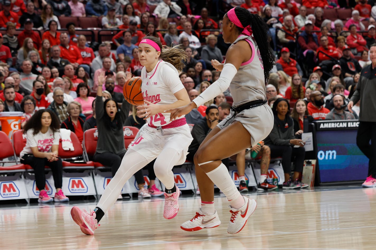 Indiana's Sara Scalia, left, drives to the basket as Ohio State's Cotie McMahon defends during the first half of an NCAA college basketball game on Monday, Feb. 13, 2023, in Columbus, Ohio. (AP Photo/Jay LaPrete)