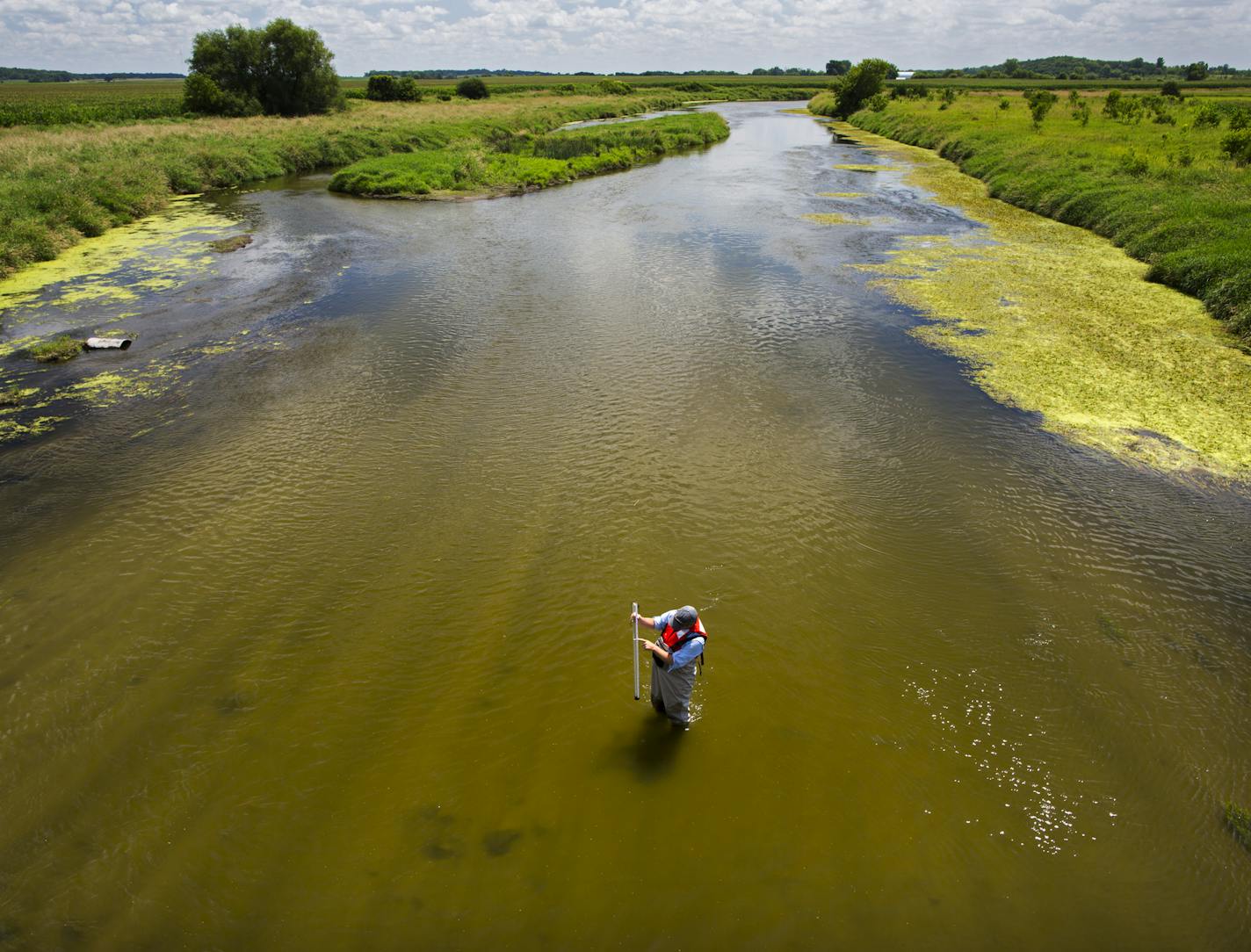 The MPCA's Mike Walerak took a sample of water from the Shell Rock River south of Albert Lea to check on pollutant loads in the area.