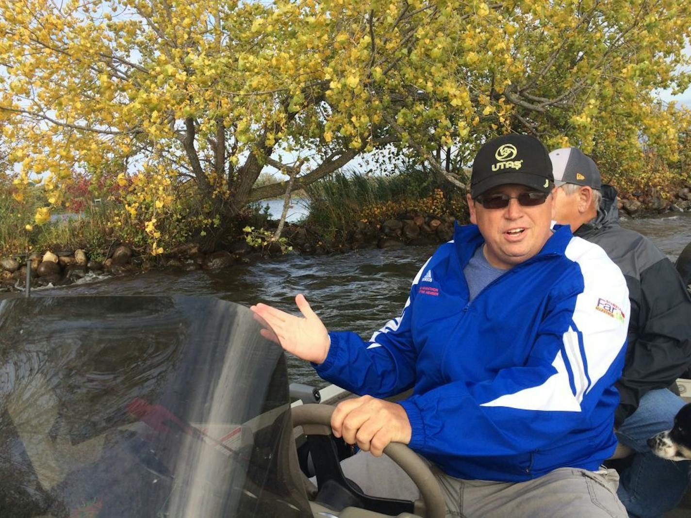 Todd Yackley, president of the West McDonald Lake Association, at the narrow bar separating his lake from neighboring Hoffman Lake. Behind him is the break where the Department of Natural Resources plans to dig a channel allowing overflow from Hoffman Lake to enter West McDonald Lake.