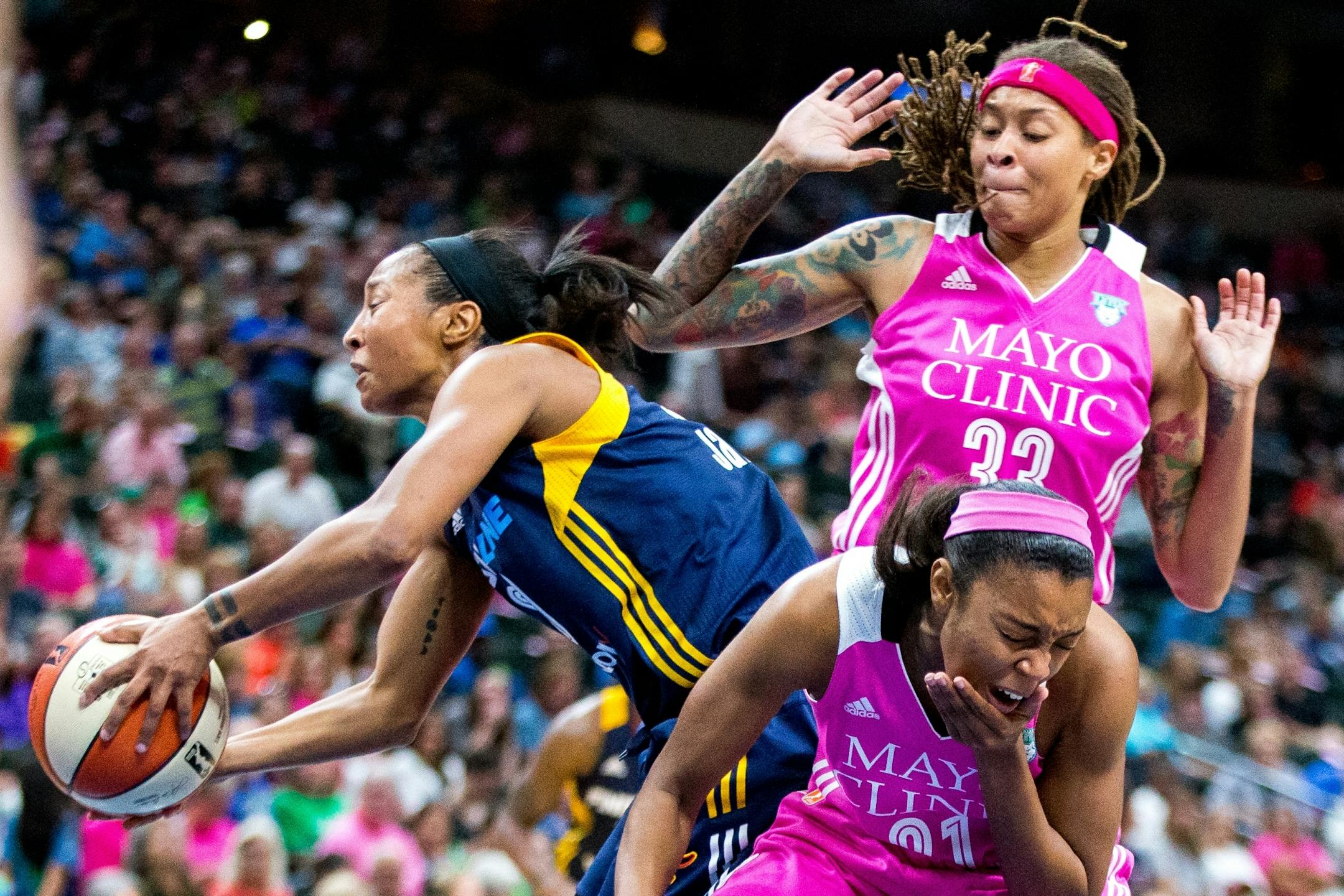Minnesota Lynx guard Renee Montgomery (21) grabs her jaw after being fouled by Indiana Fever�s Briann January (20) during the second half on Friday, Aug. 18, 2017, at Xcel Energy Center.