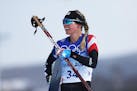 Jessie Diggins reacts during the Women’s Cross-Country 10K Classic during the Beijing 2022 Winter Olympics at the National Cross-Country Skiing Cent
