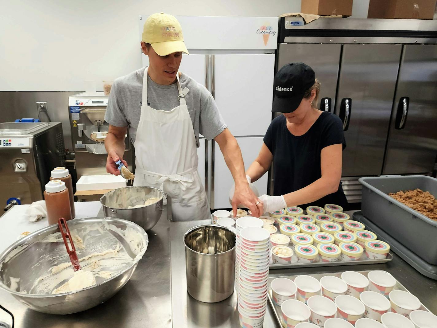 Zach Vraa and his mother Mona are the assembly line at A to Z Creamery, where every cup for the 2023 Minnesota State Fair is packed by hand.