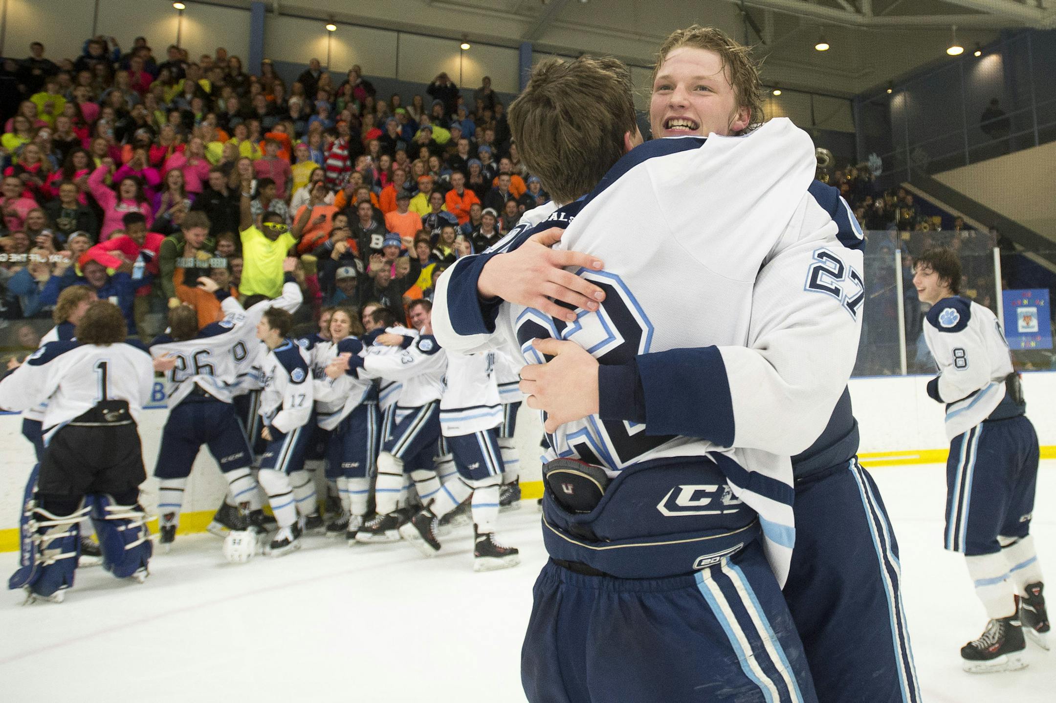 Blaine forward Easton Brodzinski (22) and forward Riley Tufte (27) embrace each other after defeating Centennial 8-1 in the Class 2A Section 5 boy's hockey final at Aldrich Arena. ] (Aaron Lavinsky | StarTribune) Blaine plays Centennial in the Class 2A Section 5 boy's hockey final at Aldrich Arena in Maplewood.