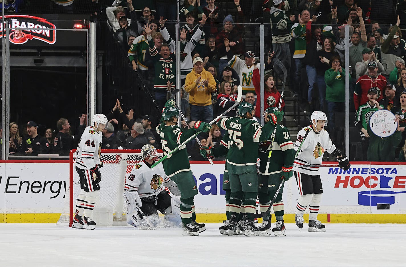 Wild right wing Ryan Reaves (75) celebrates with teammates after scoring a goal against the Chicago Blackhawks during the second period.