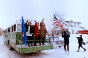 December 29, 1990 Paul Wellstone leaves for DC in the bus from in front of the Croatian Hall in S. St. Paul Saturday am L-R: Daughter Marcia, wife She