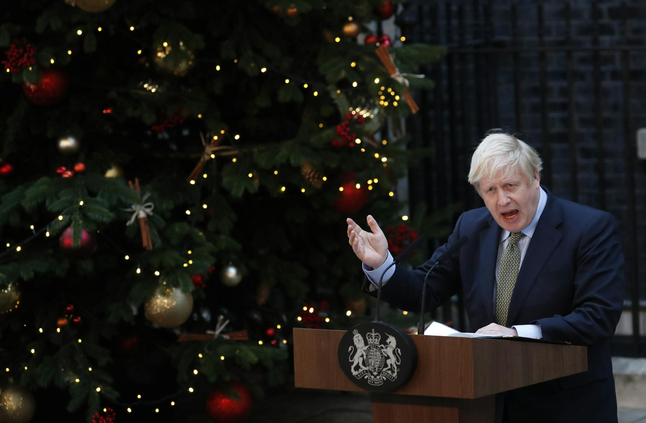Britain's Prime Minister Boris Johnson addresses the media outside 10 Downing Street in London, Friday, Dec. 13, 2019. Johnson's Conservative Party has won a thumping majority of seats in Britain's Parliament — a decisive outcome to a Brexit-dominated election that should allow Johnson to fulfill his plan to take the U.K. out of the European Union next month.(AP Photo/Frank Augstein)
