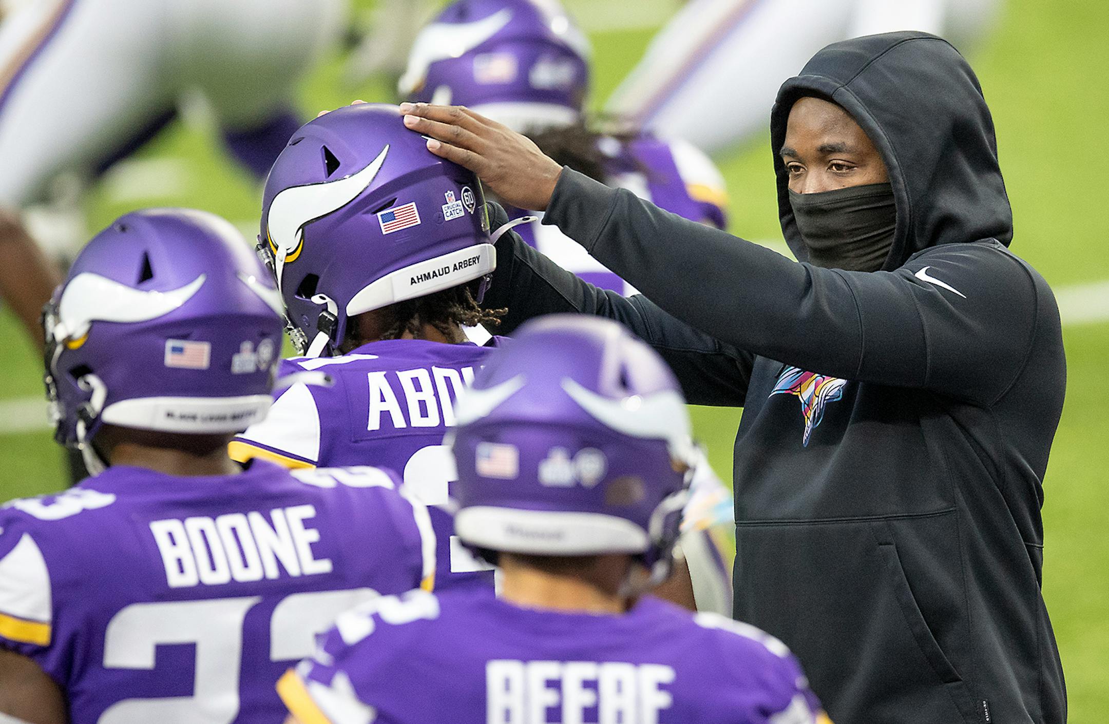 Minnesota Vikings running back Dalvin Cook cheering on teammates during pre-game warm-ups on the field.