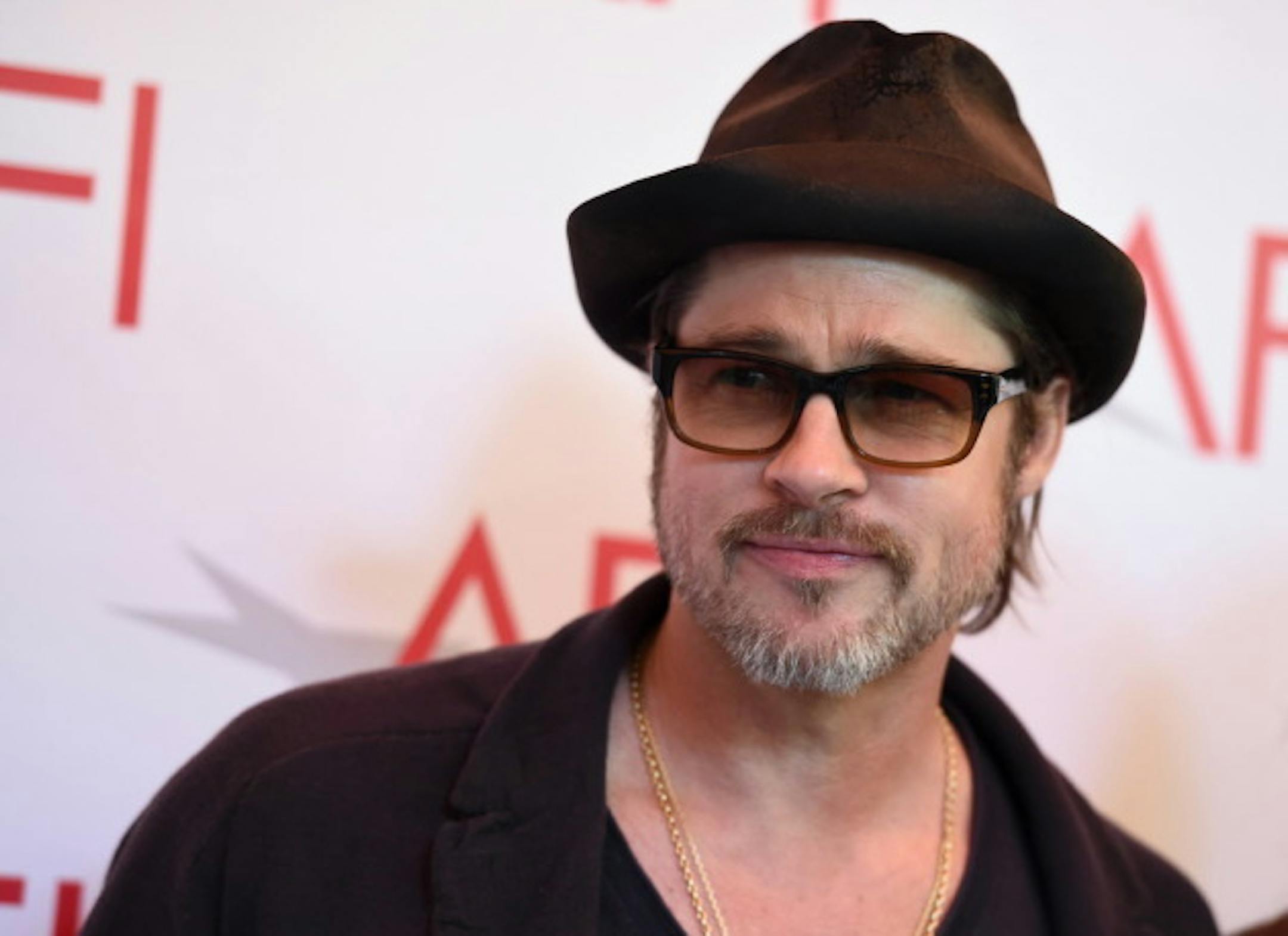 FILE - In this Friday, Jan. 9, 2015, file photo, Brad Pitt arrives at the AFI Awards at The Four Seasons Hotel in Los Angeles. Netflix has acquired the satirical comedy 'War Machine,' with Pitt set to star as General Stanley McChrystal. The acquisition, announced Monday, June 8, 2015, by Netflix, adds a major dose of star power to the streaming service's growing stable of original films. Netflix will produce the film, to be directed by Australian filmmaker David Michod. (Photo by Jordan Strauss/Invision/AP, File)
