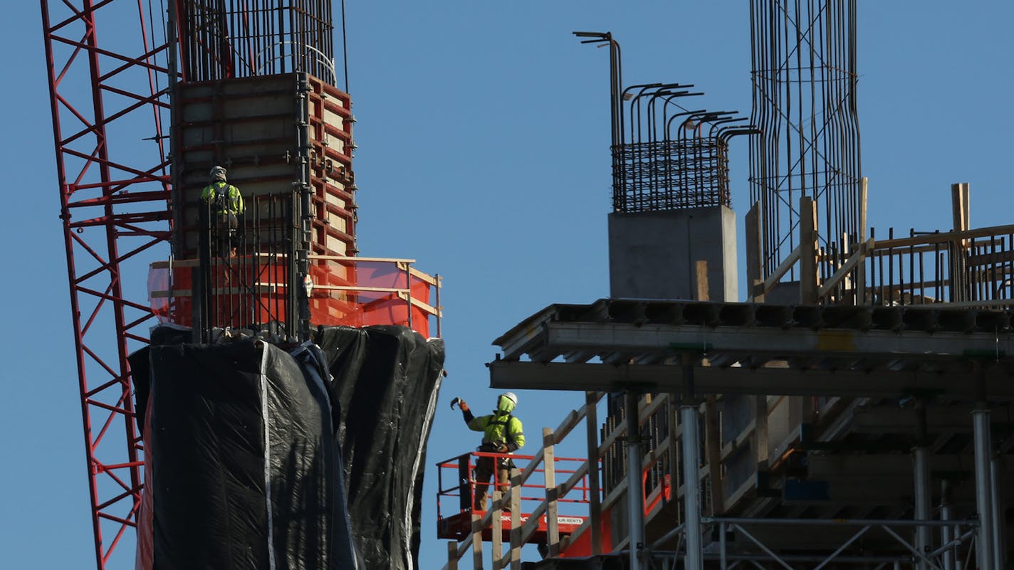 Worker continued construction with the weather in the single digits on the Vikings stadium continues. ] (KYNDELL HARKNESS/STAR TRIBUNE) kyndell.harkness@startribune.com The building of the Vikings Stadium in Minneapolis Min., Tuesday, January 13, 2014. ORG XMIT: MIN1501131516472369