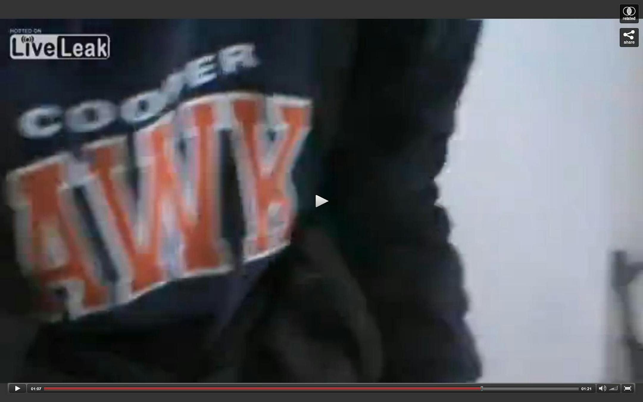 A closer look at a Syrian sniper, recorded in a video, and his interesting choice of work clothing, namely a Robbinsdale Cooper High School sweatshirt.