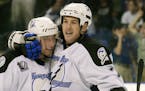 Tampa Bay Lightning right wing Ben Clymer (7) celebrates his goal against the New York Rangers with center Vaclav Prospal in 2001.