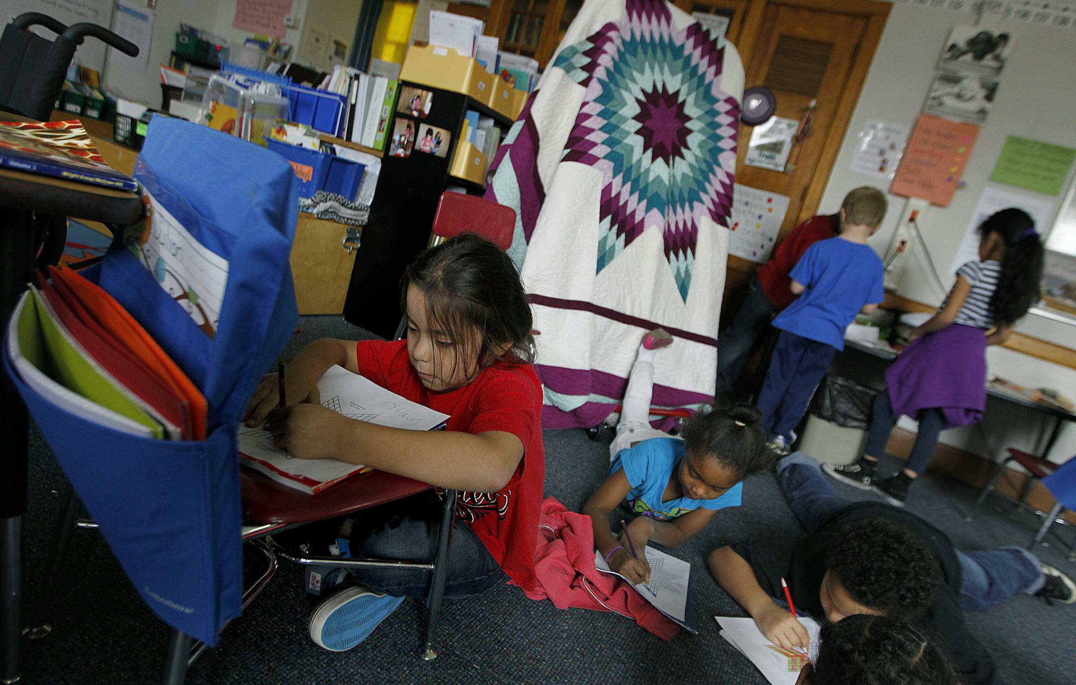 American Indian Magnet School first-grader Cylas Spears worked on creating an Eagle quilt project during class Wednesday, November 27, 2013 in St. Paul, MN. (ELIZABETH FLORES/STAR TRIBUNE) ELIZABETH FLORES • eflores@startribune.com