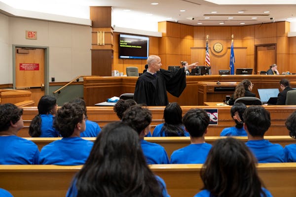 Ramsey County District Judge Jacob Kraus described how his courtroom operates to the students participating in Latino Lawyer Camp.