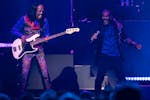 Earth Wind & Fire bassist Verdine White and singer B. David Whitworth groove during the Heart & Soul Tour with Chicago at Xcel Energy Center.