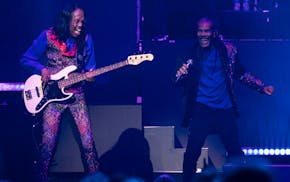 Earth Wind & Fire bassist Verdine White and singer B. David Whitworth groove during the Heart & Soul Tour with Chicago at Xcel Energy Center.