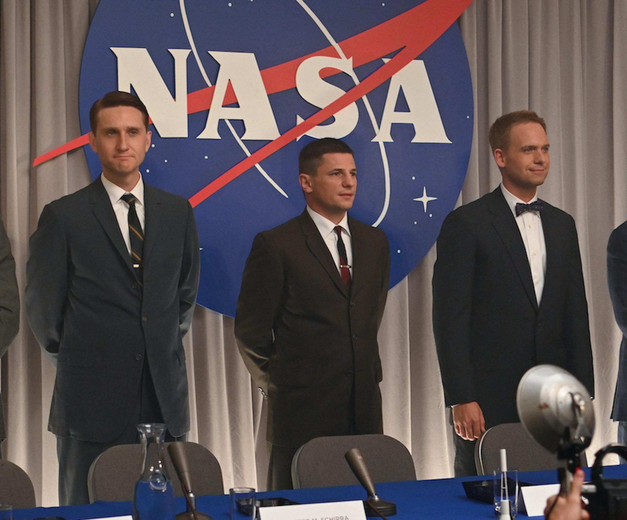 This image released by Disney Plus shows, from left, Micah Stock, Jake McDornan, Aaron Staton, Michael Trotter, Patrick J. Adams, Colin O'Donoghue and James Lafferty in a scene from "The Right Stuff," premiering Oct. 9. (Disney Plus via AP)