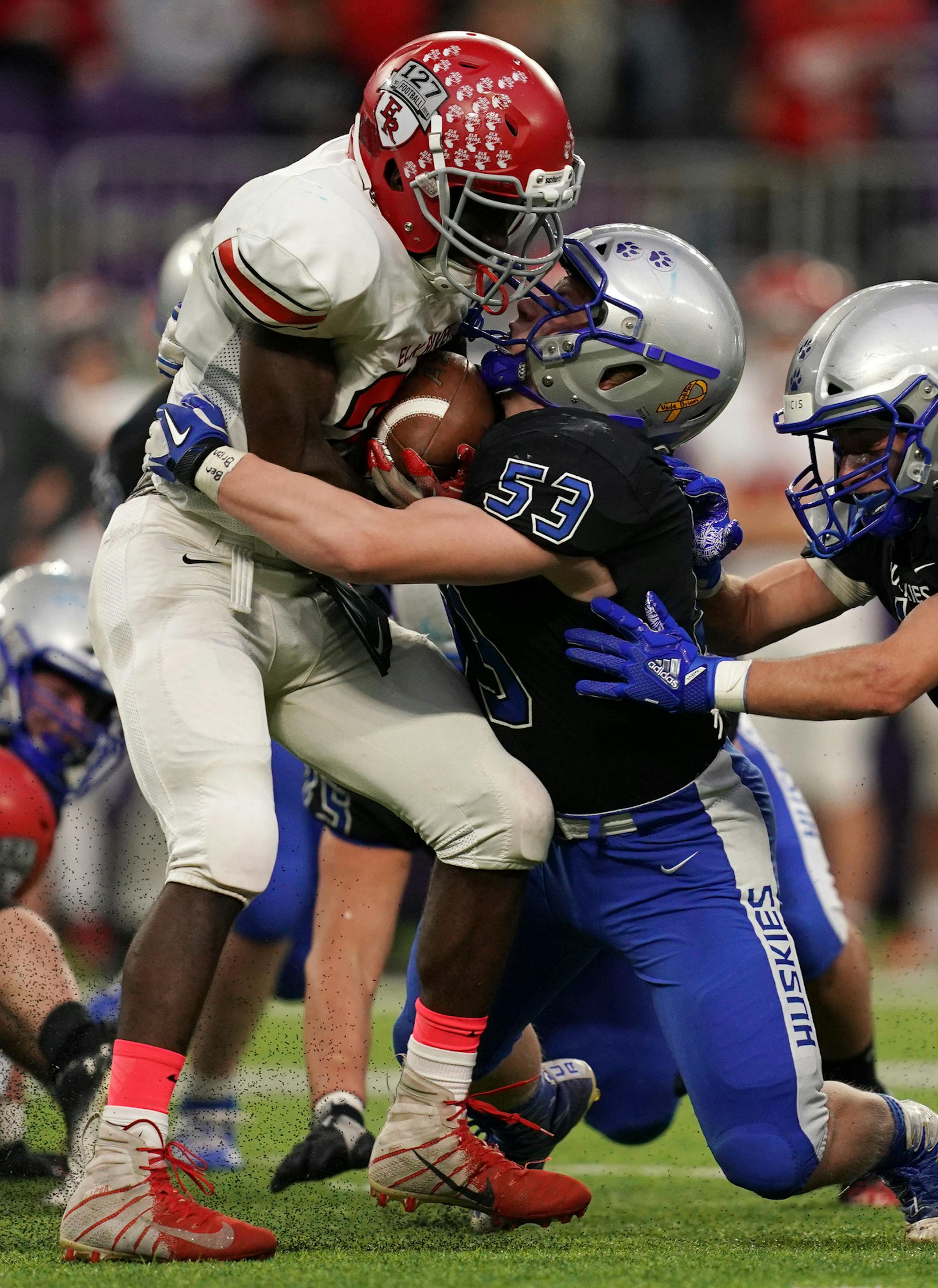 Elk River running back Kevin Egbujor (27) was tackled by Owatonna offensive lineman Nick Staska (53) as he ran the ball in the first half. ] ANTHONY SOUFFLE &#xef; anthony.souffle@startribune.com Owatonna High School played Elk River High School in a Class 5A MSHSL football semifinal game Friday, Nov. 16, 2018 at U.S. Bank Stadium in Minneapolis.