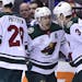 Minnesota Wild left wing Zach Parise, center, celebrates his goal against the Toronto Maple Leafs with teammates Charlie Coyle (3) and Greg Pateryn (2