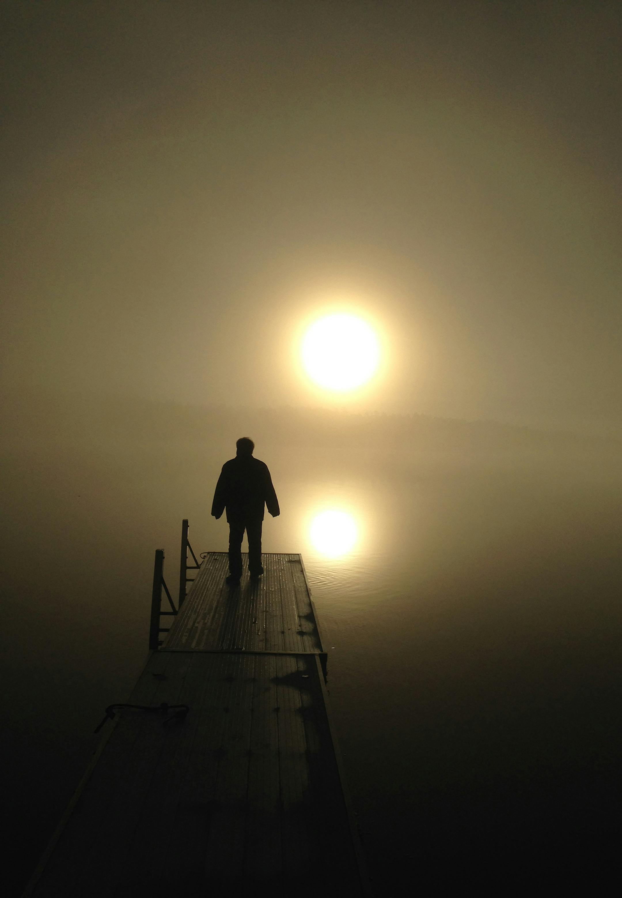 Maureen Feely of Plymouth took this photo of her husband out on their dock in Island Lake in Spooner, Wis., Nov. 12.